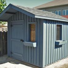 8 x 10 high board and batten with a 2 foot gable overhang.