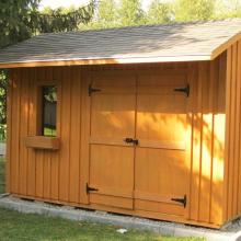 8 x 12 high board and batten with a 2 foot side overhang.