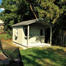 10 x 12 high board and batten with a 4 foot gable porch.