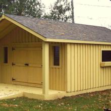 14 x 20 high board and batten with a 4 foot gable porch.
