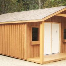 14 x 20 high board and batten with a 4 foot gable porch.